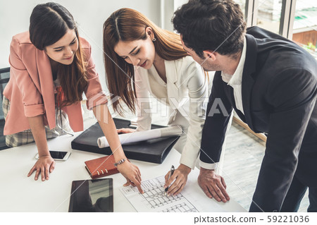 Businessman and businesswomen working in office. 59221036