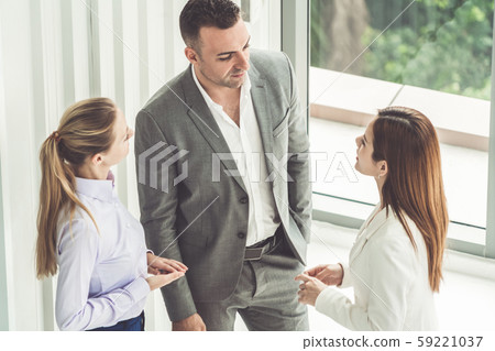 Businessman and businesswomen working in office. 59221037