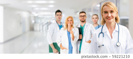 Doctor working in hospital with other doctors. Doctor working in hospital with other doctors. 59221210