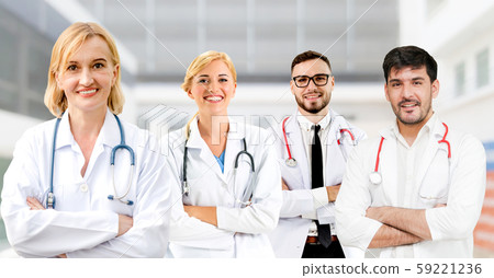 Doctor working in hospital with other doctors. 59221236
