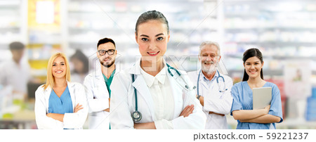 Doctor working in hospital with other doctors. 59221237