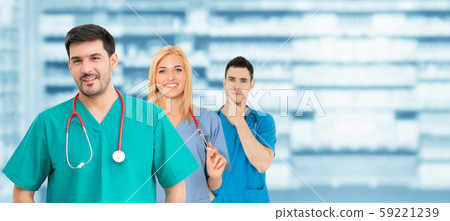 Doctor working in hospital with other doctors. 59221239