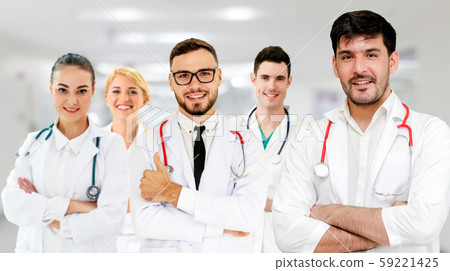 Doctor working in hospital with other doctors. 59221425