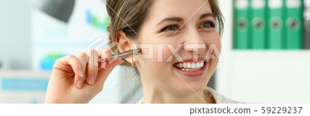 Smiling manager holding pen 59229237