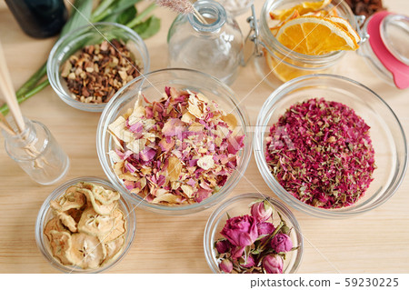 Top view of aromatic stuff in bowls on table prepared for soap making process Top view of aromatic stuff in bowls on table prepared for soap making process 59230225