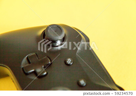 Black joystick on yellow background. Computer Black joystick on yellow background. Computer 59234570