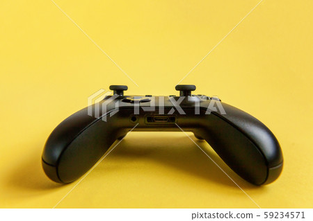 Black joystick on yellow background. Computer Black joystick on yellow background. Computer 59234571