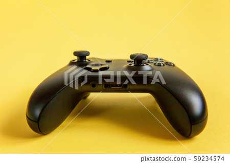 Black joystick on yellow background. Computer Black joystick on yellow background. Computer 59234574