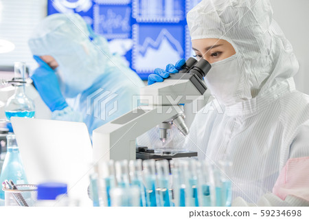 asian scientist use microscope 59234698