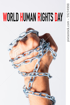 Chained fist hands with WORLD HUMAN RIGHTS DAY Chained fist hands with WORLD HUMAN RIGHTS DAY 59234998