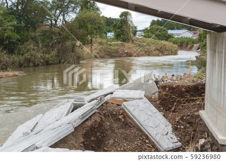 Typhoon damage river flooding embankment collapse 59236980
