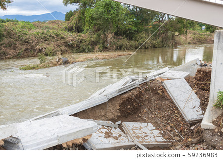 Typhoon damage river flooding embankment collapse 59236983