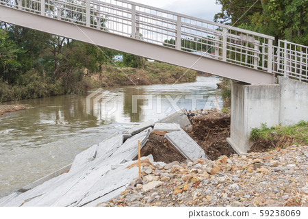 Typhoon damage river flooding embankment collapse Typhoon damage river flooding embankment collapse 59238069