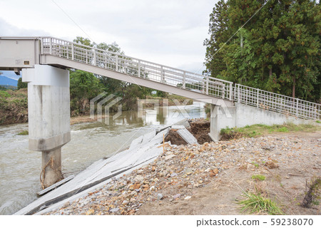 Typhoon damage river flooding embankment collapse 59238070