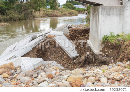 Typhoon damage river flooding embankment collapse 59238071