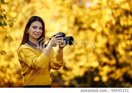 women photographer hold camera 59245151