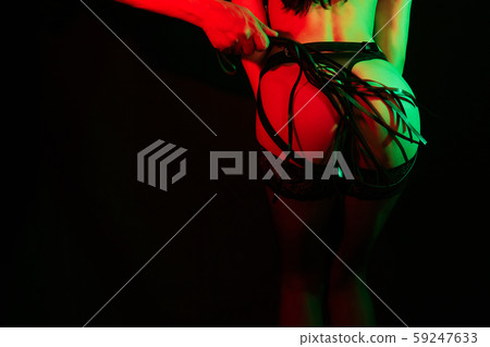 Male dominant spanks with a leather whip on the ass of a submissive girl Male dominant spanks with a leather whip on the ass of a submissive girl 59247633