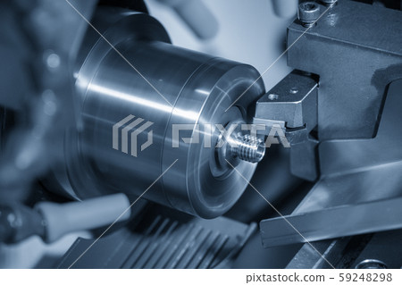 The CNC lathe machine in metal working process The CNC lathe machine in metal working process 59248298