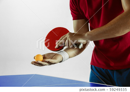 Young man playing table tennis on white studio background Young man playing table tennis on white studio background 59249335