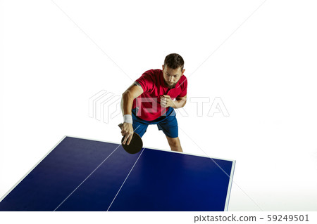Young man playing table tennis on white studio background 59249501