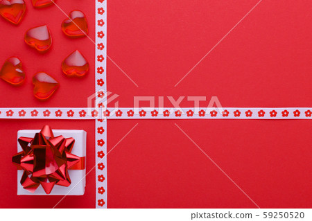 red background with gift box and hearts, copy space red background with gift box and hearts, copy space 59250520