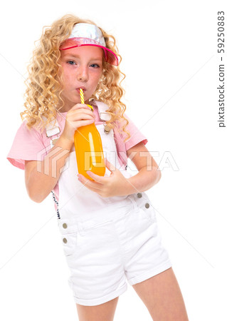 Happy child with fair red curly hair drink orange juice, picture isolated on white background 59250883