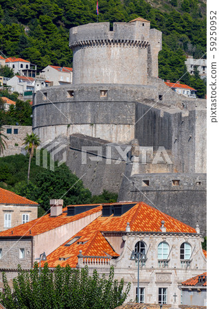 Dubrovnik. Old city walls and towers at sunset. Dubrovnik. Old city walls and towers at sunset. 59250952