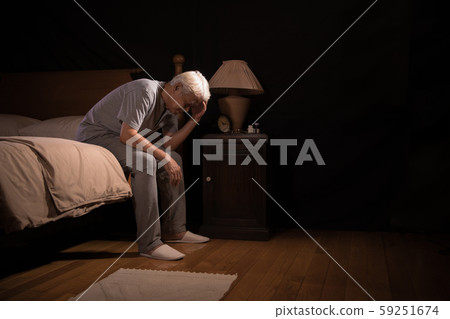 Depressed senior person sitting in bed cannot sleep from insomnia Depressed senior person sitting in bed cannot sleep from insomnia 59251674