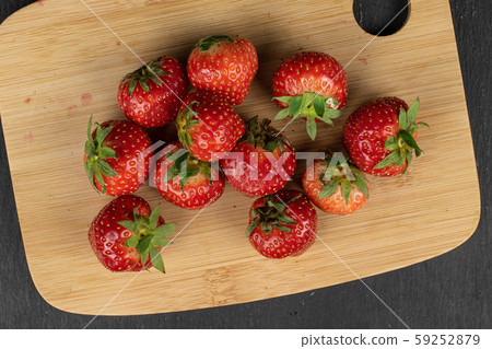 Fresh red strawberry on grey stone 59252879