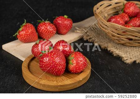 Fresh red strawberry on grey stone 59252880