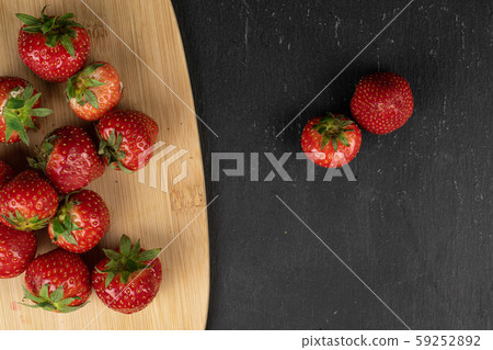 Fresh red strawberry on grey stone Fresh red strawberry on grey stone 59252892