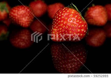 Fresh red strawberry isolated on black glass Fresh red strawberry isolated on black glass 59252893