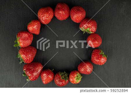 Fresh red strawberry on grey stone 59252894