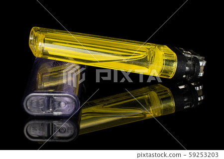 Plastic lighter isolated on black glass 59253203