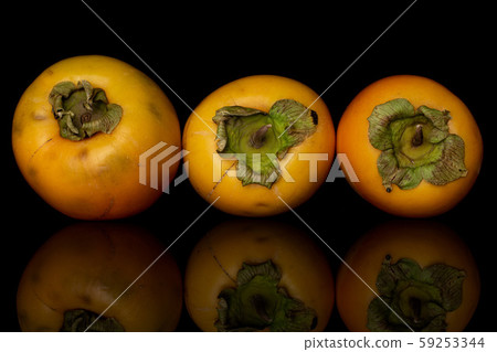 Sweet orange persimmon isolated on black glass 59253344