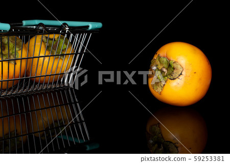 Sweet orange persimmon isolated on black glass 59253381