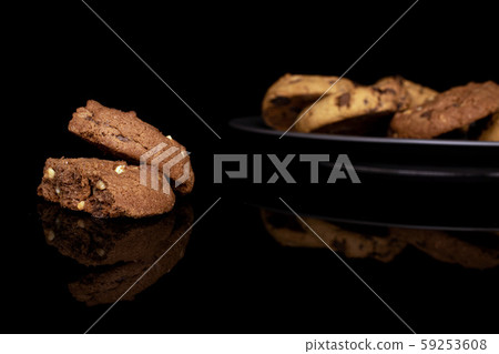 Sweet brown cookie isolated on black glass Sweet brown cookie isolated on black glass 59253608