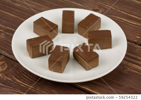 Sweet viennese nougat on brown wood 59254322