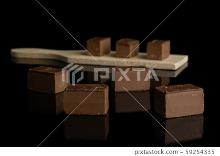 Sweet viennese nougat isolated on black glass Sweet viennese nougat isolated on black glass 59254335