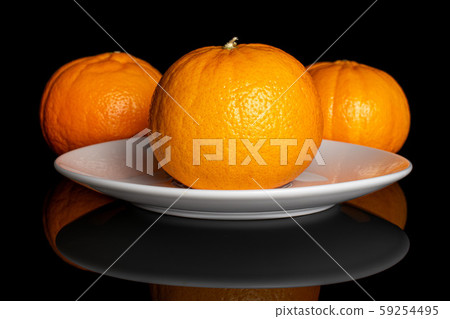 Fresh orange mandarine isolated on black glass Fresh orange mandarine isolated on black glass 59254495