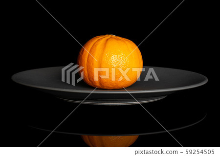 Fresh orange mandarine isolated on black glass 59254505
