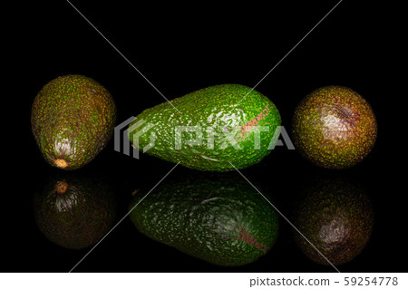 Fresh green avocado isolated on black glass Fresh green avocado isolated on black glass 59254778