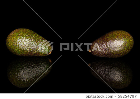 Fresh green avocado isolated on black glass Fresh green avocado isolated on black glass 59254797