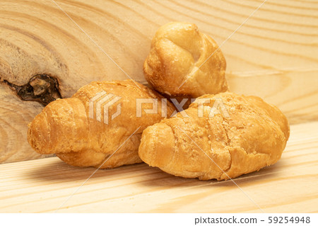 Fresh mini croissant on wood Fresh mini croissant on wood 59254948
