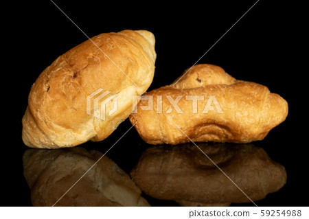 Fresh mini croissant isolated on black glass Fresh mini croissant isolated on black glass 59254988