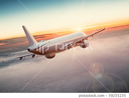Commercial airplane flying above dramatic clouds. Commercial airplane flying above dramatic clouds. 59255235