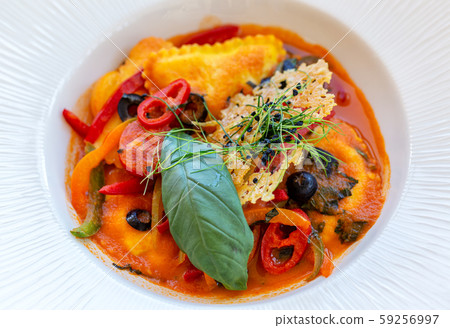 Cod ravioli with stewed vegetables, vegetarian dish. Cod ravioli with stewed vegetables, vegetarian dish. 59256997