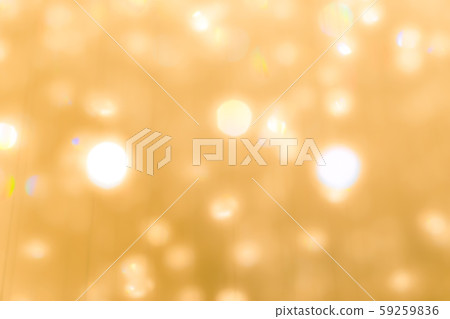 Blur yellow gold bokeh background of reflective glittering light from holiday party crystal ball chandelier 59259836