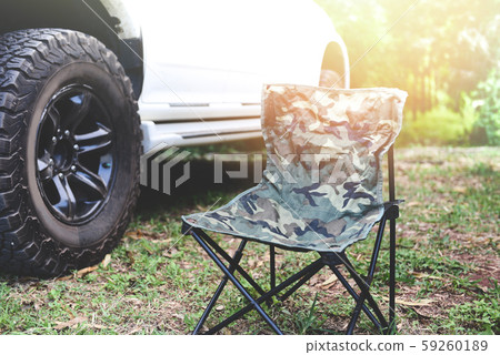 Folding chair on the Camping with Off road pickup Folding chair on the Camping with Off road pickup 59260189