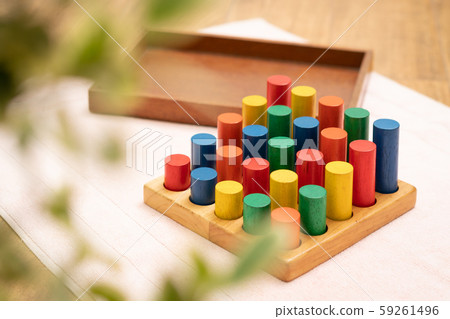 Top view closeup of colorful wooden Montessori sensorial material learning, Sizing and order block. Kindergarten educational toys, Thinking process, Cognitive skills, Learn Through Play tools concept. Top view closeup of colorful wooden Montessori sensorial material learning, Sizing and order block. Kindergarten educational toys, Thinking process, Cognitive skills, Learn Through Play tools concept. 59261496